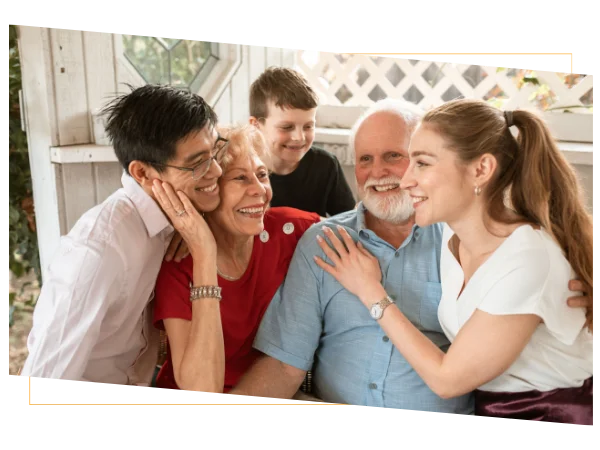 Family and loved ones smiling together while sharing health insurance tips Family and loved ones smiling together while sharing health insurance tips