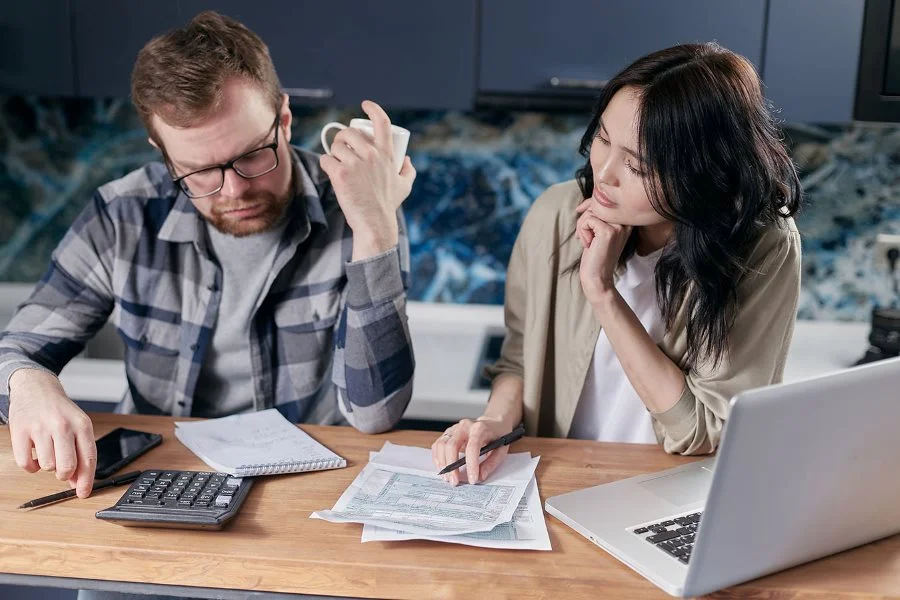 Two people reviewing healthcare savings options and planning their medical expenses together