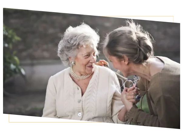 Older woman sharing health insurance tips with a woman while discussing healthcare needs Older woman sharing health insurance tips with a woman while discussing healthcare needs
