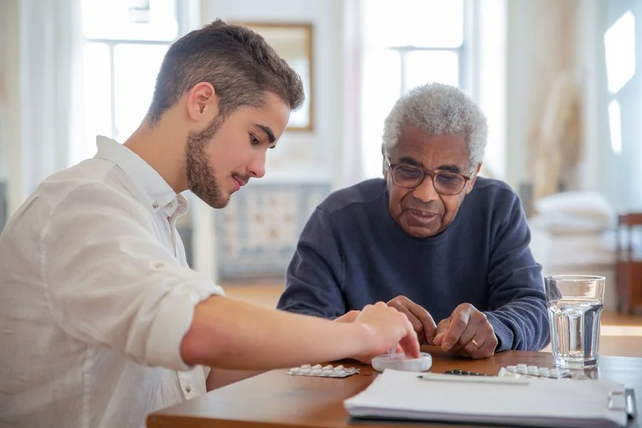Older adult discussing healthcare savings and reviewing important documents